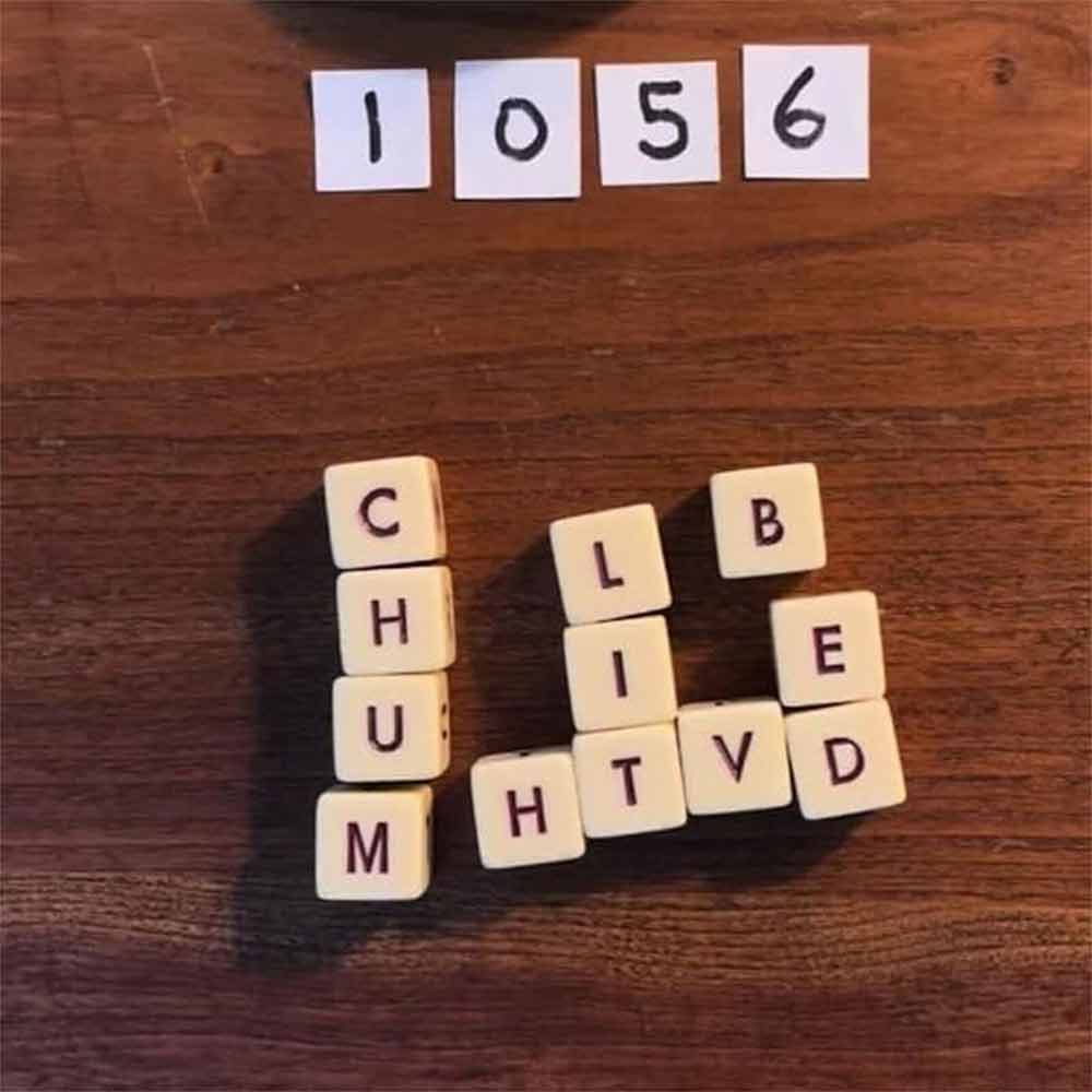 New Q-less Dice Game with Twelve Dice Letters, The Crossword Solitaire Game
